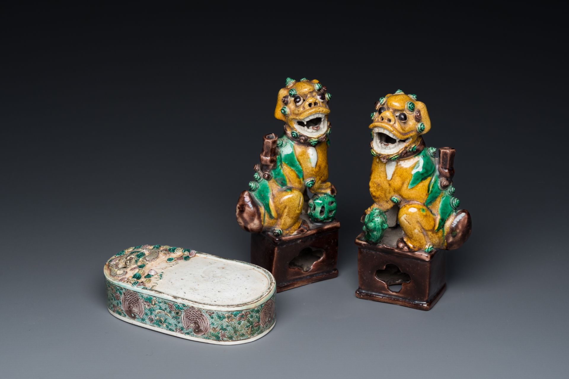 A pair of Chinese sancai incense stick holders and a verte biscuit inkstone, Kangxi or later