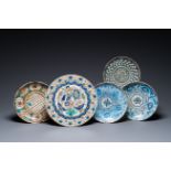 Five blue and white and polychrome Islamic pottery dishes, Qajar, Persia, 19th C.