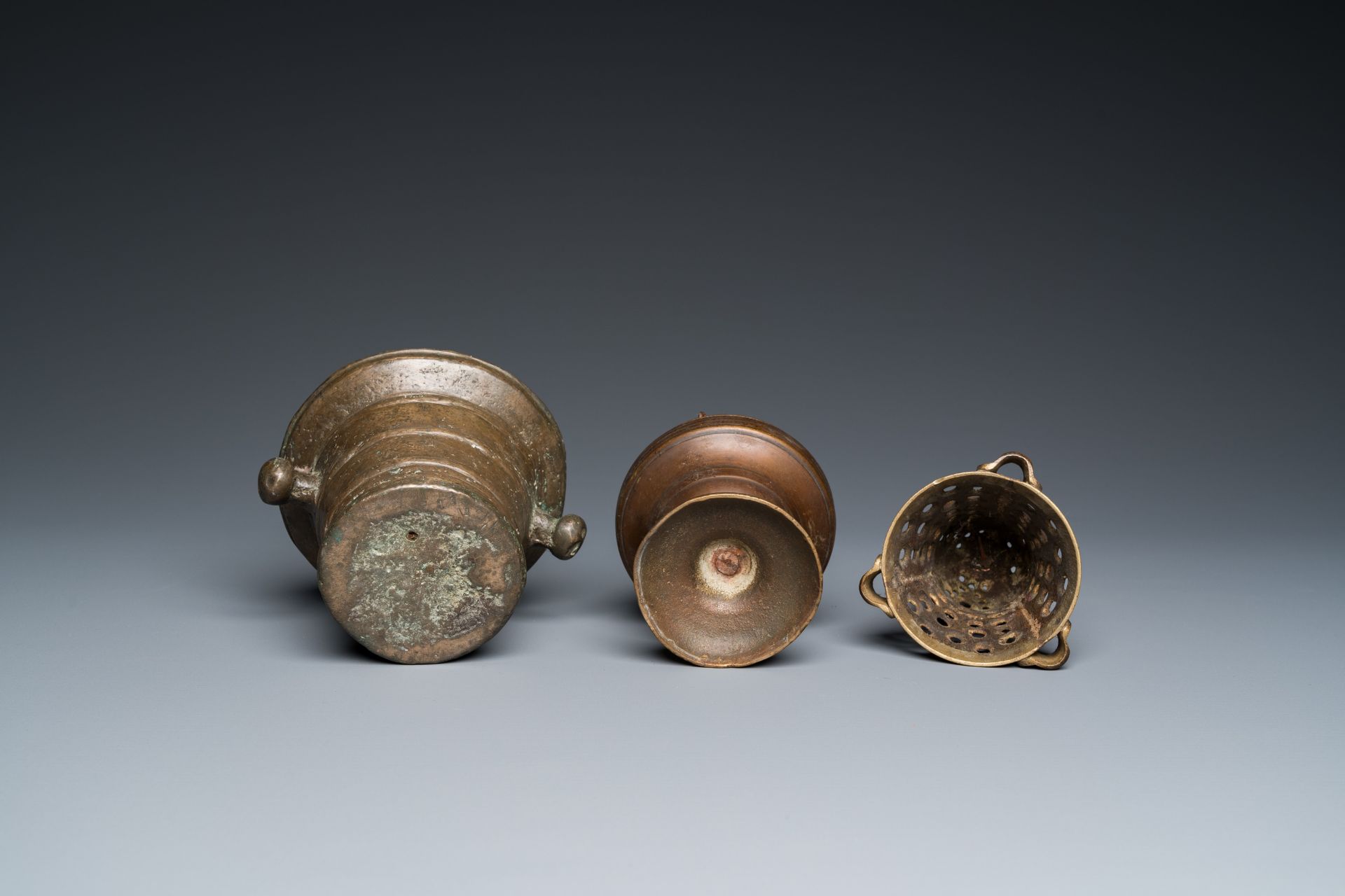 A bronze mortar, a censer and two pax of which one gilded, Western Europe, 16/17th C. - Image 7 of 9