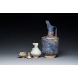 Three blue- and turquoise-glazed Islamic pottery wares and a glass bottle, Kashan and Raqqa, 12th C.