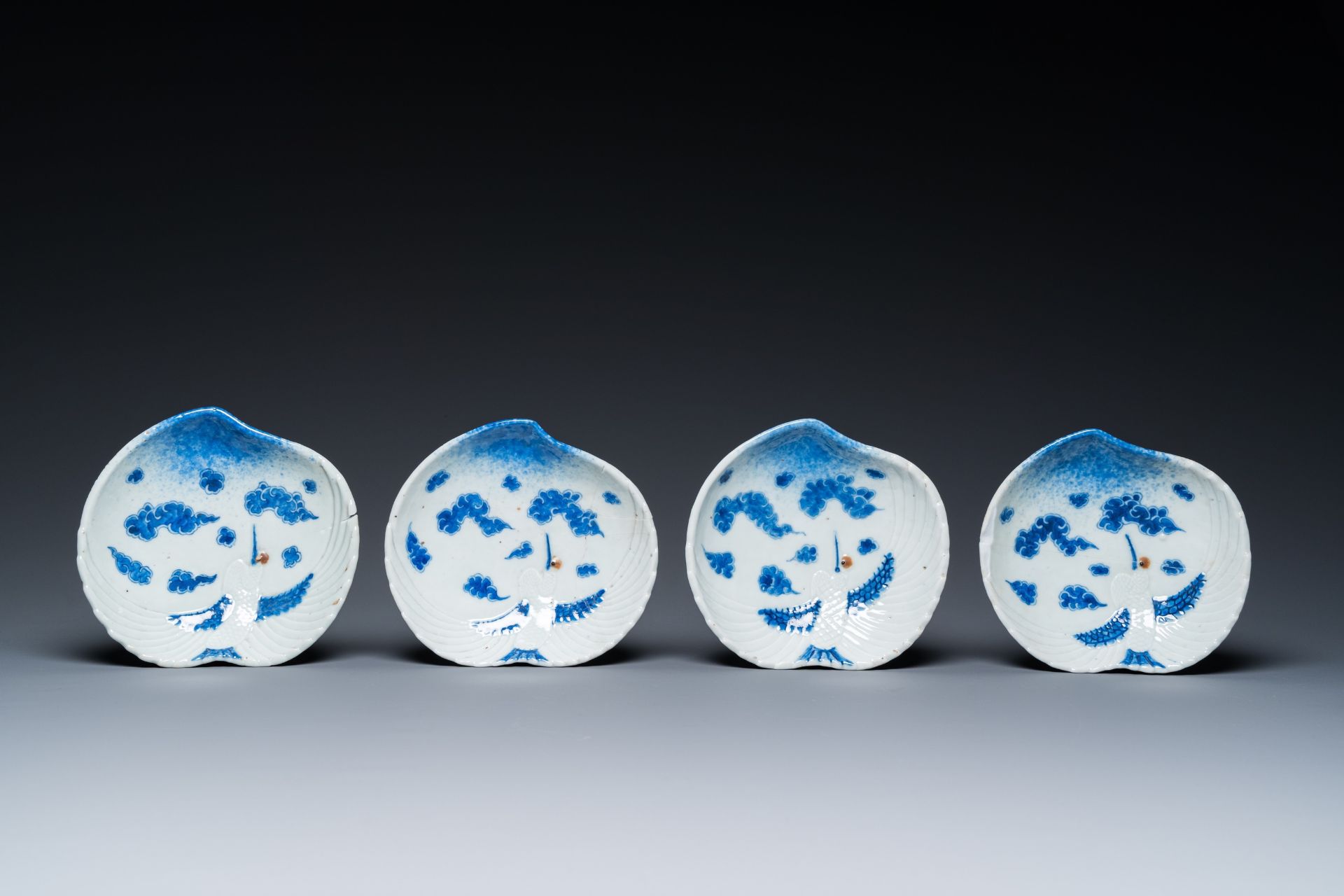 Four Japanese blue and white peach-shaped 'crane' dishes standing on three feet, Edo, 18/19th C. - Image 2 of 4