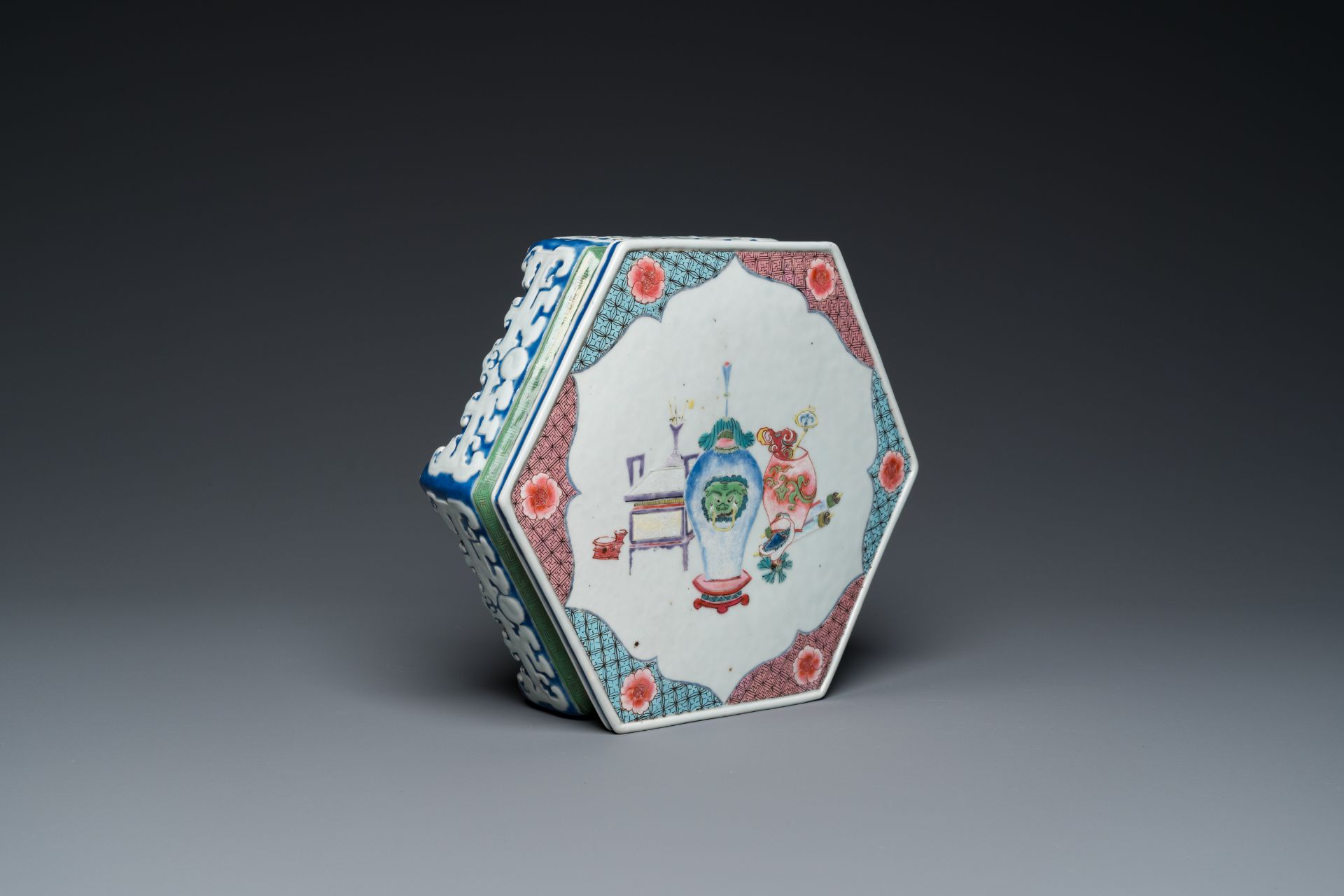 A rare Chinese famille rose hexagonal 'antiquities' stand, Yongzheng