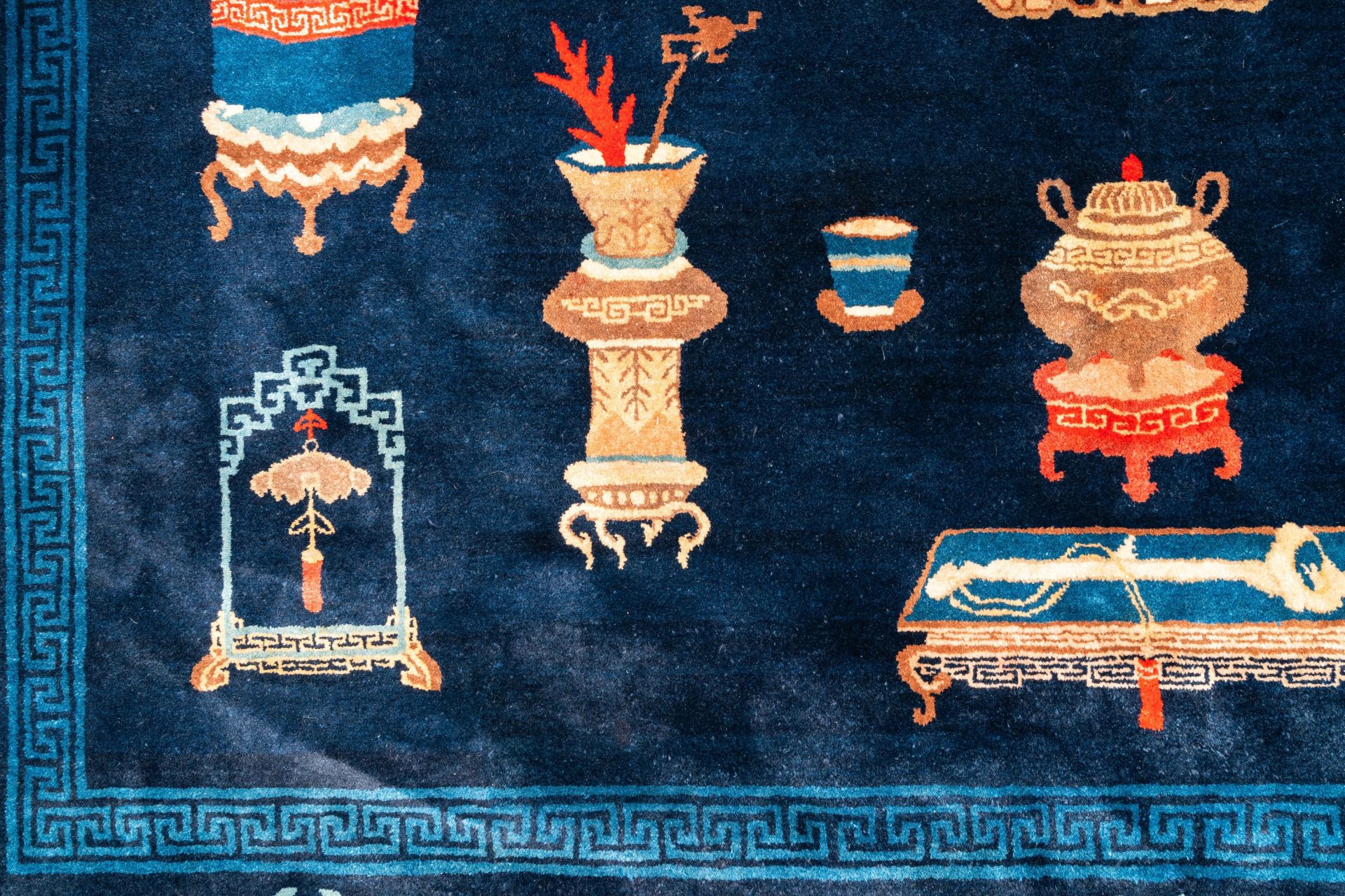 A large Chinese blue-ground 'antiquities' rug, 19th C. - Image 3 of 6