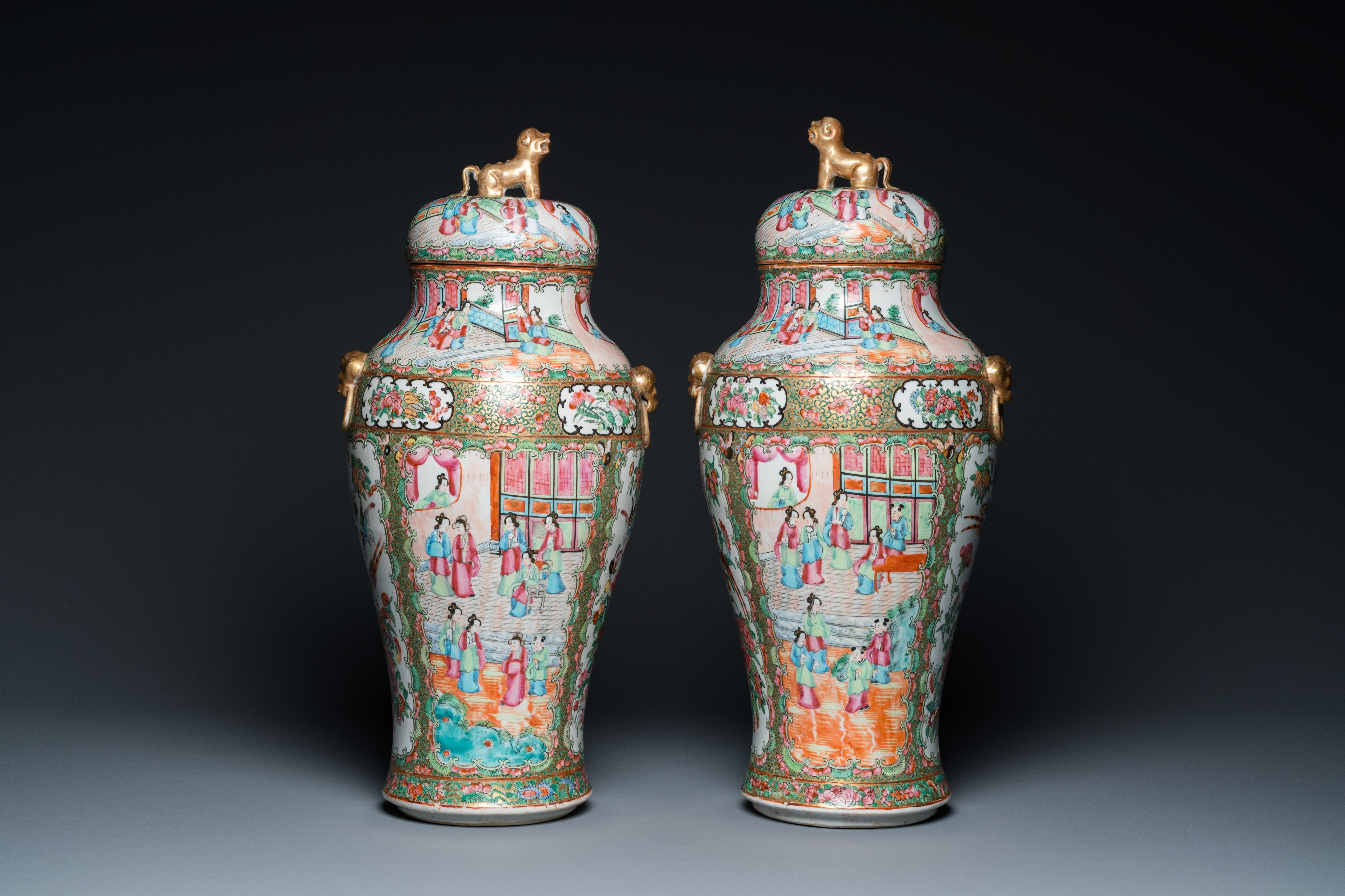 A pair of Chinese Canton famille rose vases and covers, 19th C.