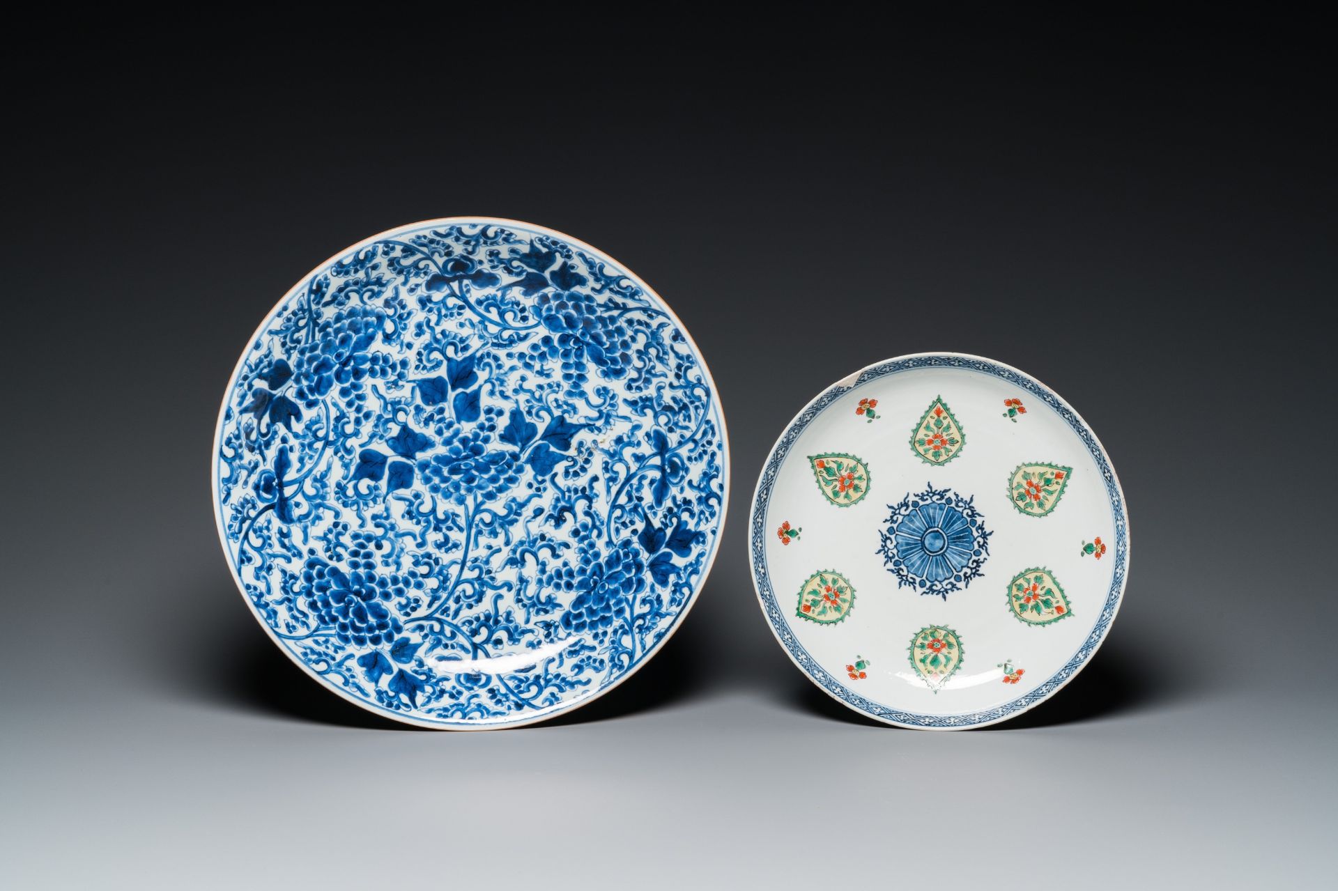 A Chinese blue and white 'peony scroll' dish and a famille verte dish, Kangxi - Image 2 of 3