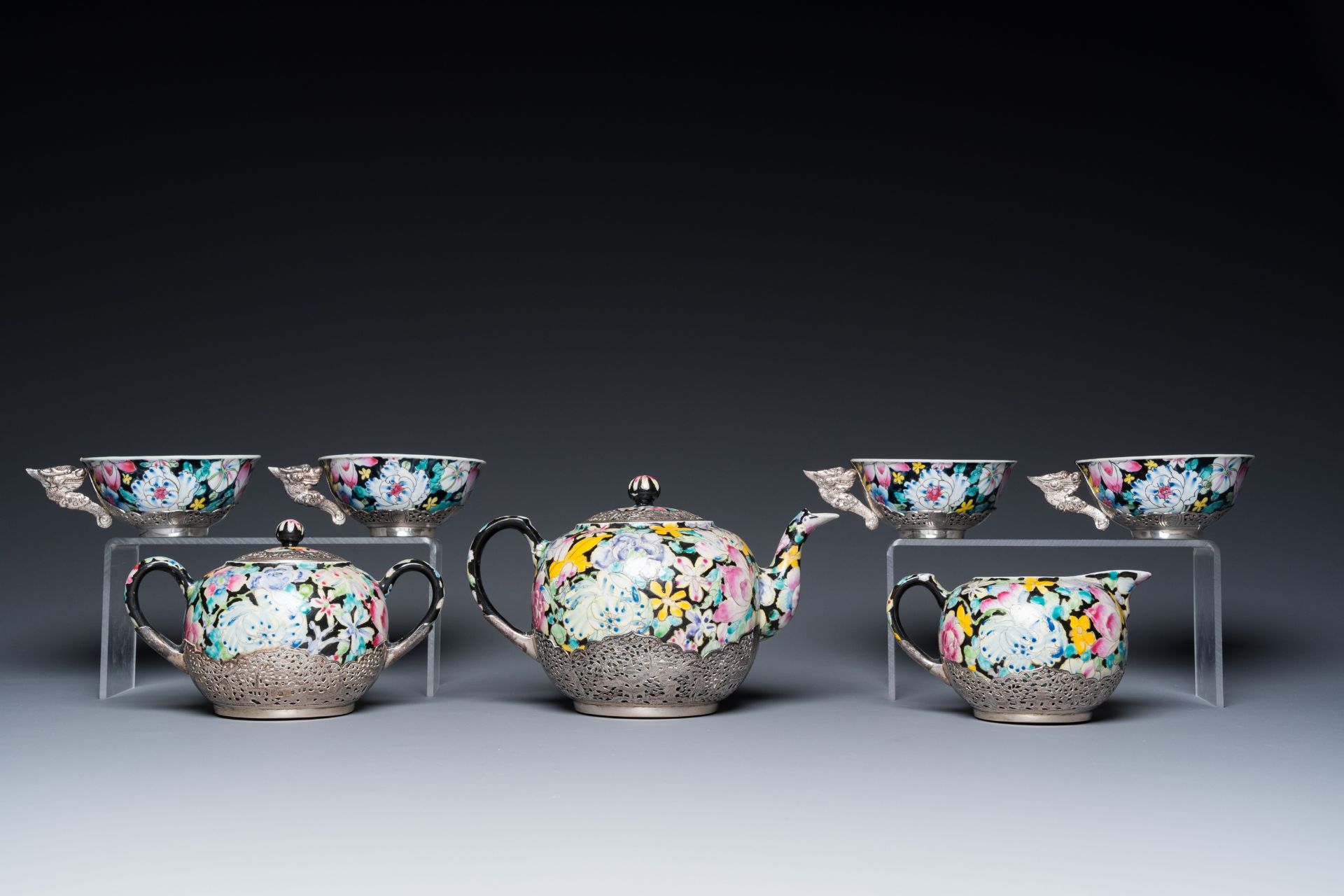 A Chinese eight-piece silver-mounted famille rose millefleurs tea service, Qianlong mark 20th C. - Image 6 of 12