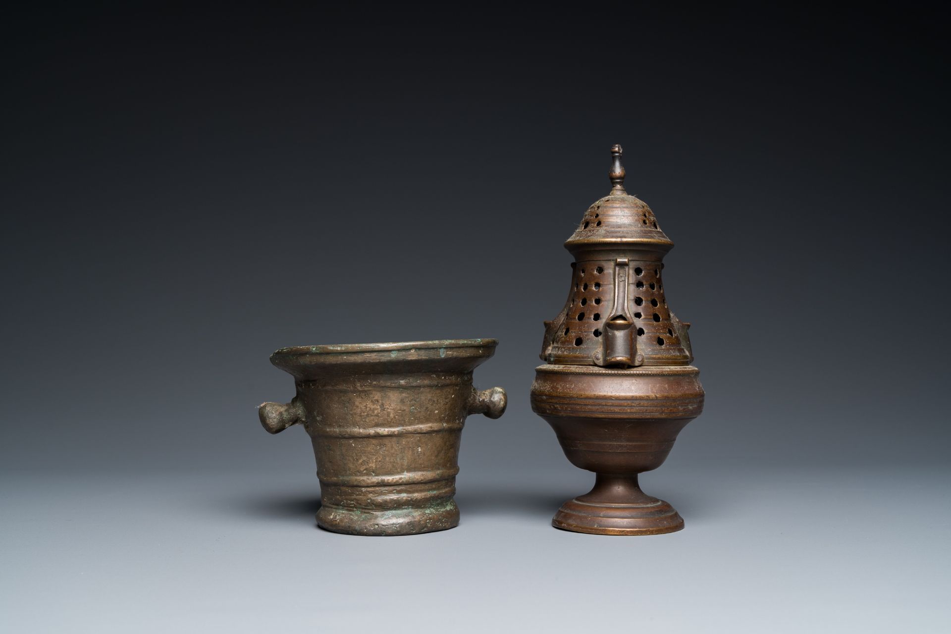 A bronze mortar, a censer and two pax of which one gilded, Western Europe, 16/17th C. - Image 2 of 9