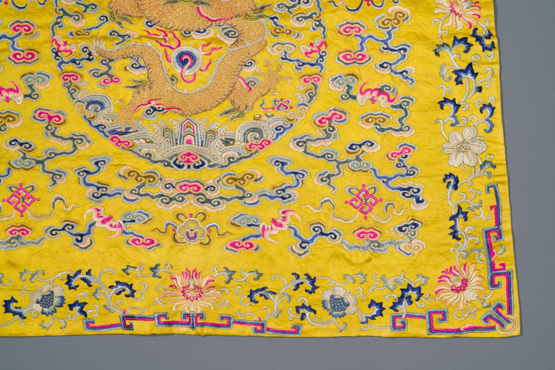 An imperial Chinese embroidered silk gold-thread yellow-ground cushion cover, 19th C. - Image 5 of 5