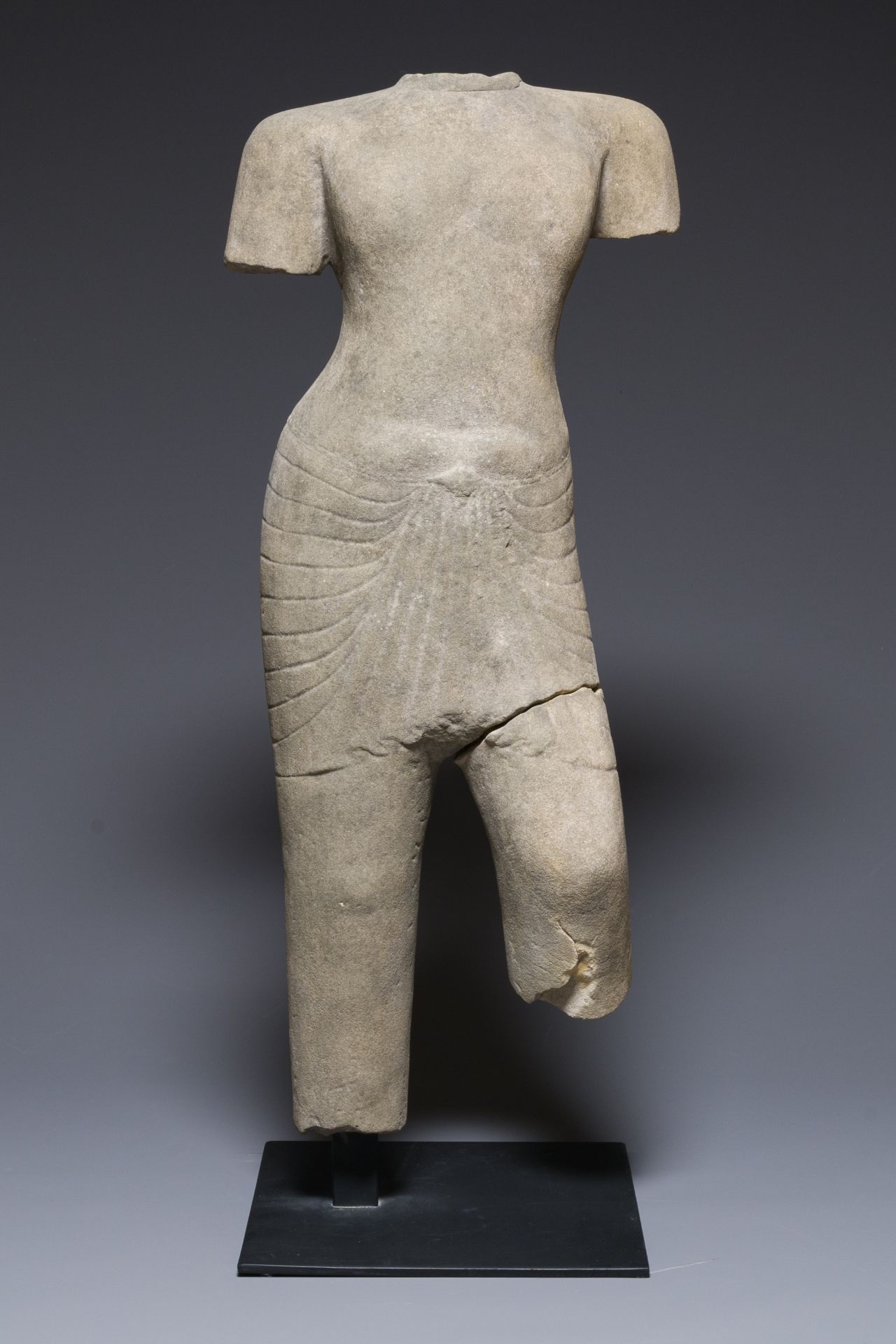 A sandstone torso of a Khmer deity, Pre Angkor period, Phnom Da, Cambodia, ca. 6th C. - Image 2 of 7