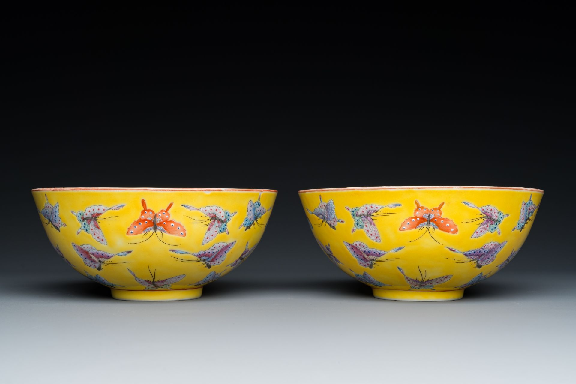 A pair of Chinese famille rose yellow-ground 'butterfly' bowls, Tongzhi mark and of the period - Image 5 of 7