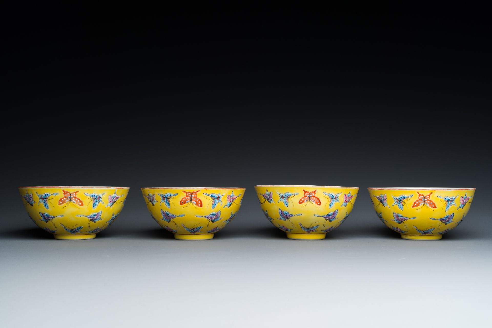 Four Chinese famille rose yellow-ground 'butterfly' bowls, Tongzhi mark and of the period - Image 2 of 7