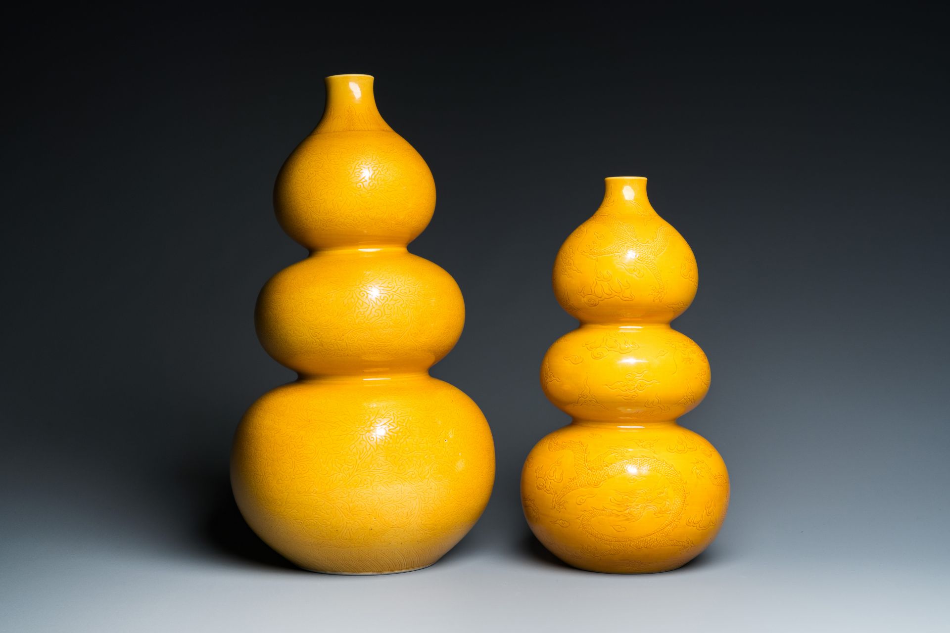 Two Chinese monochrome yellow-glazed triple gourd vases with incised designs of lotus scrolls and dr - Image 5 of 7