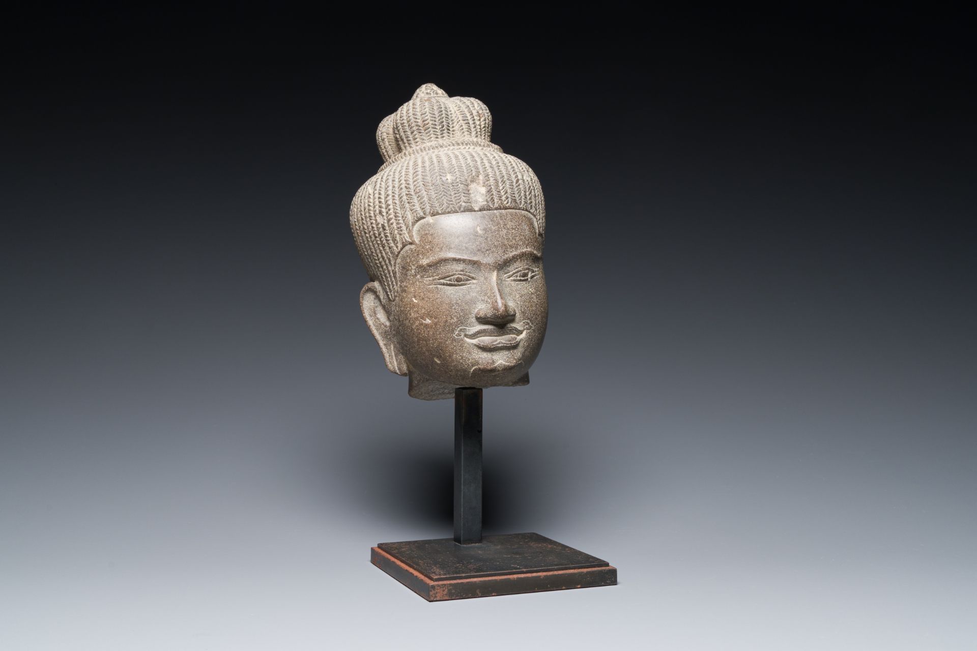 A Khmer polished sandstone head of Uma in Baphuon-style, Angkor period, Cambodia, 11th C.