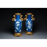 A pair of Chinese blue, white and copper-red powder blue-ground rouleau vases with fine gilt bronze