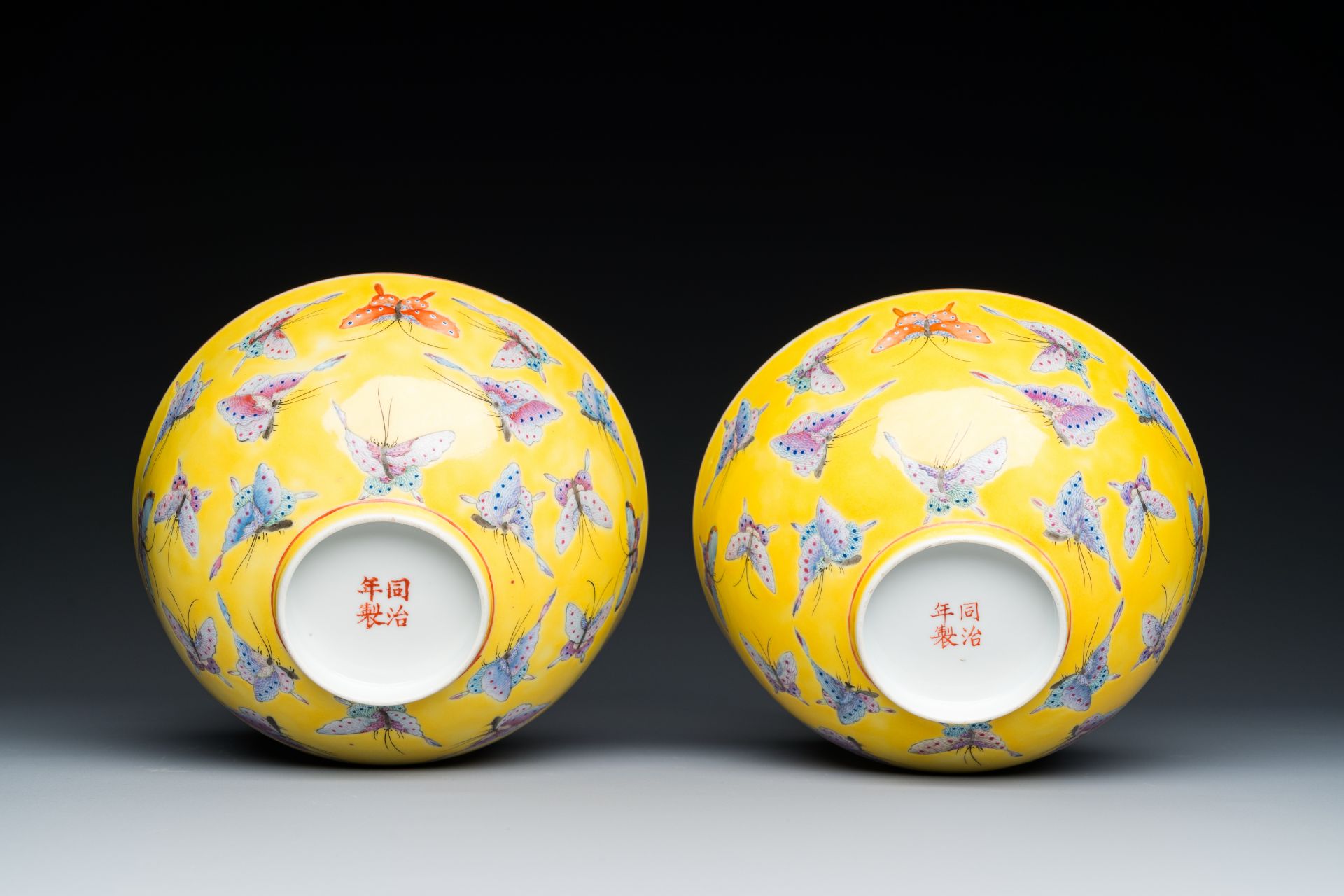 A pair of Chinese famille rose yellow-ground 'butterfly' bowls, Tongzhi mark and of the period - Image 7 of 7