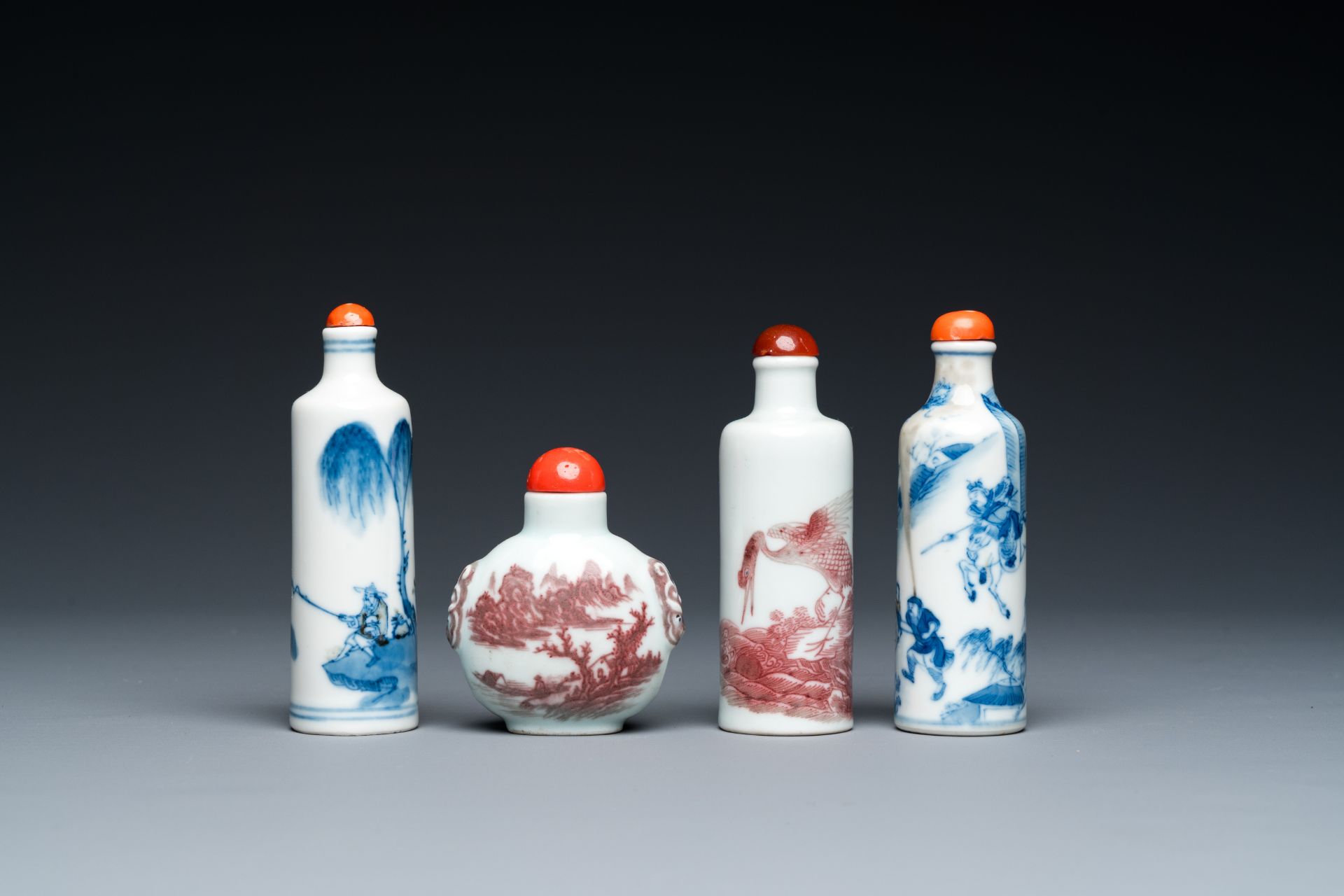 Four Chinese blue, white and copper-red snuff bottles, 19th C.