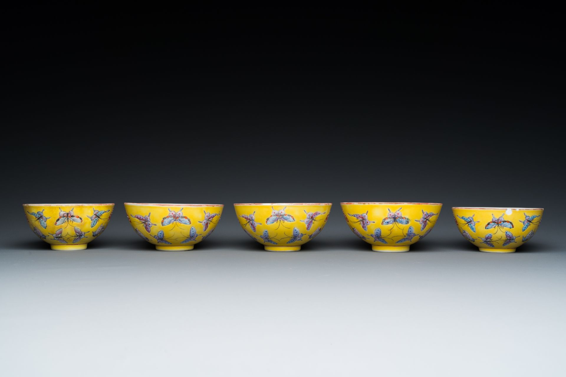Five Chinese famille rose yellow-ground 'butterfly' bowls, Tongzhi mark and of the period - Image 4 of 7