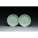 A pair of Chinese monochrome celadon-glazed plates, Qianlong mark and of the period