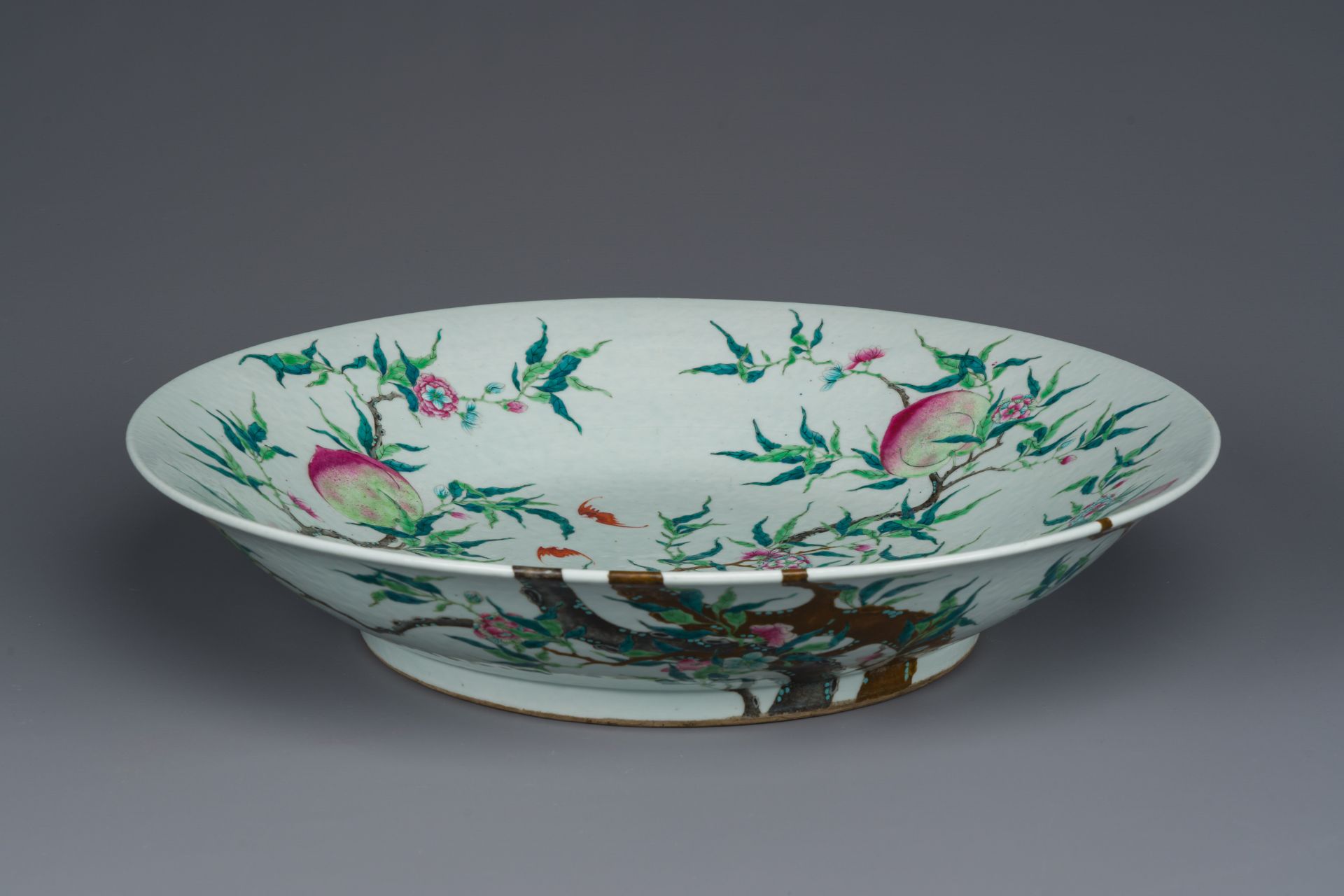 A fine and large Chinese famille rose 'nine peaches' dish, Qianlong mark, 19th C. - Image 3 of 3