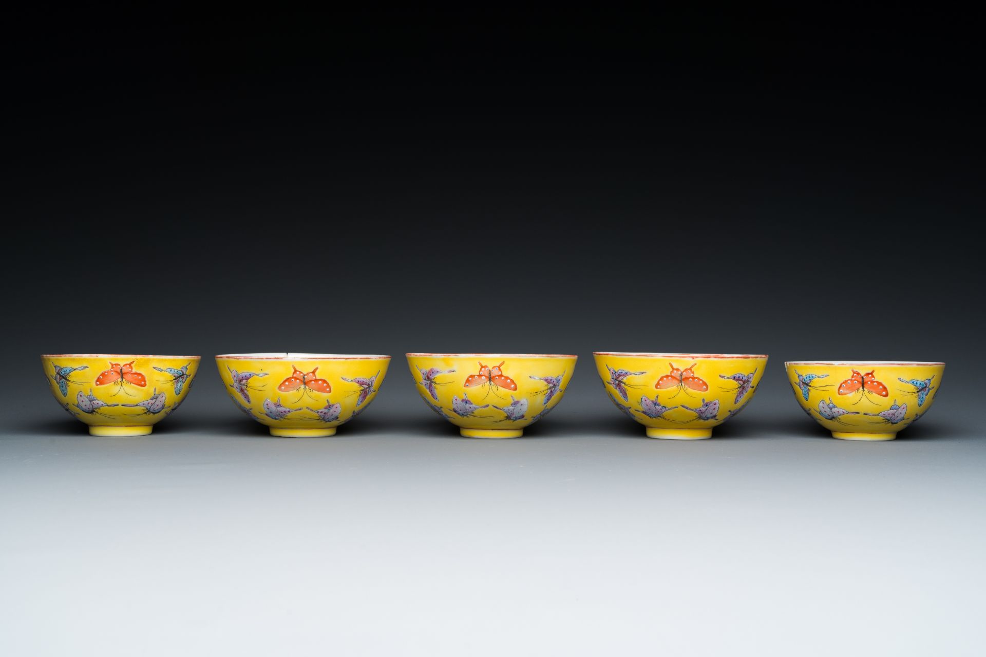 Five Chinese famille rose yellow-ground 'butterfly' bowls, Tongzhi mark and of the period - Image 5 of 7