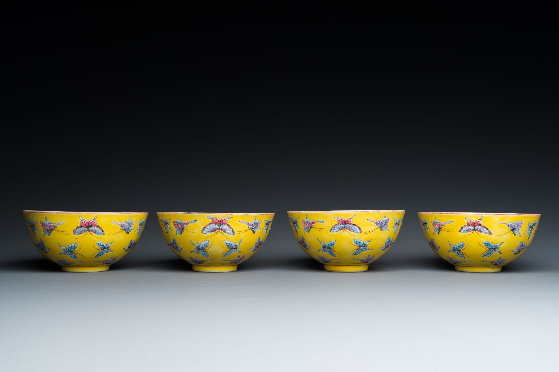 Four Chinese famille rose yellow-ground 'butterfly' bowls, Tongzhi mark and of the period - Image 5 of 7