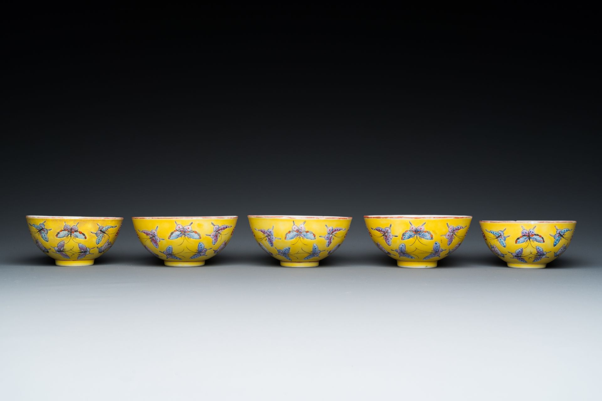 Five Chinese famille rose yellow-ground 'butterfly' bowls, Tongzhi mark and of the period - Image 2 of 7