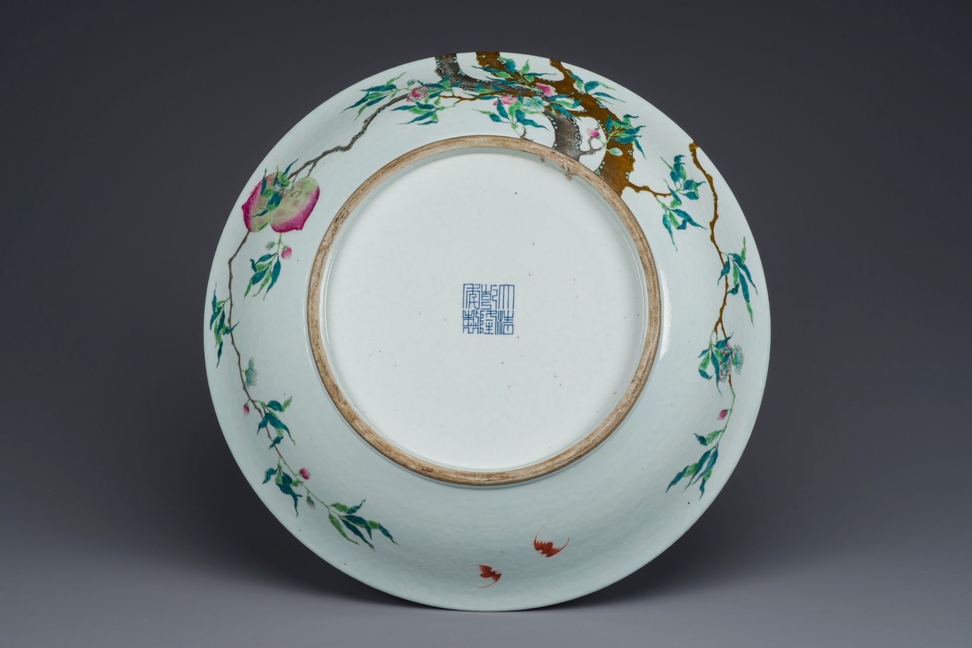 A fine and large Chinese famille rose 'nine peaches' dish, Qianlong mark, 19th C. - Image 2 of 3