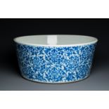 An exceptionally large Chinese blue and white basin with floral scrolls, Kangxi