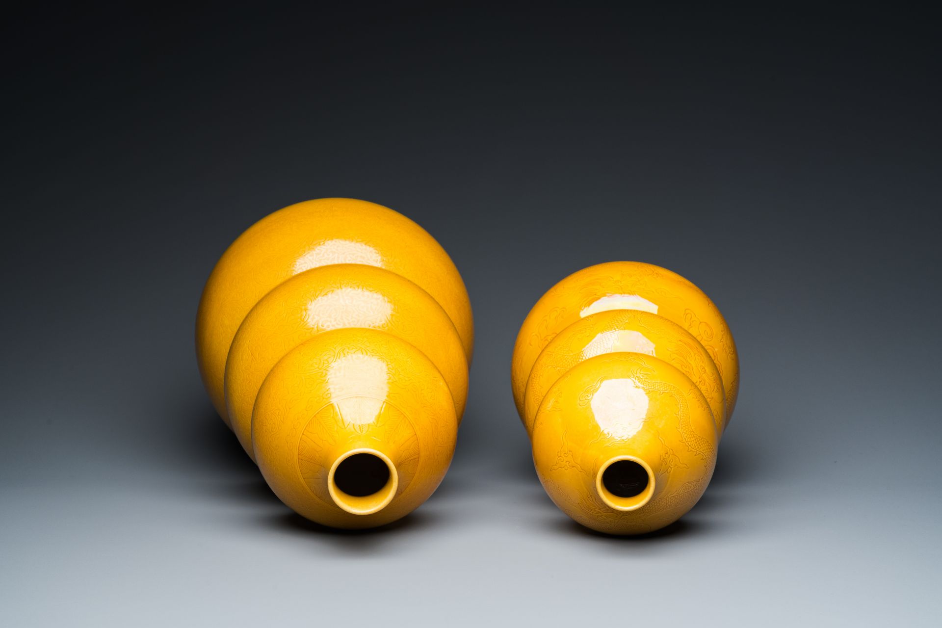 Two Chinese monochrome yellow-glazed triple gourd vases with incised designs of lotus scrolls and dr - Image 6 of 7