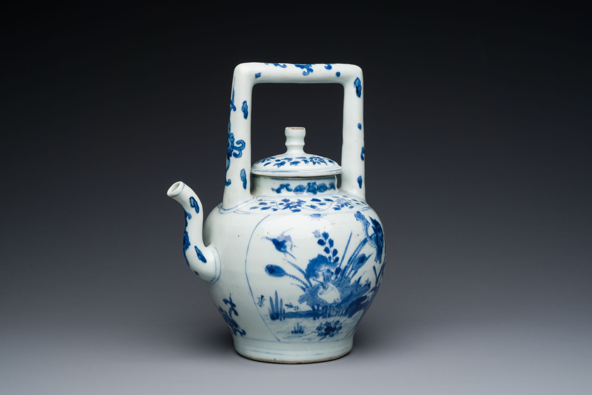 A large Chinese blue and white 'crane and lotus' wine ewer and cover, Transitional period