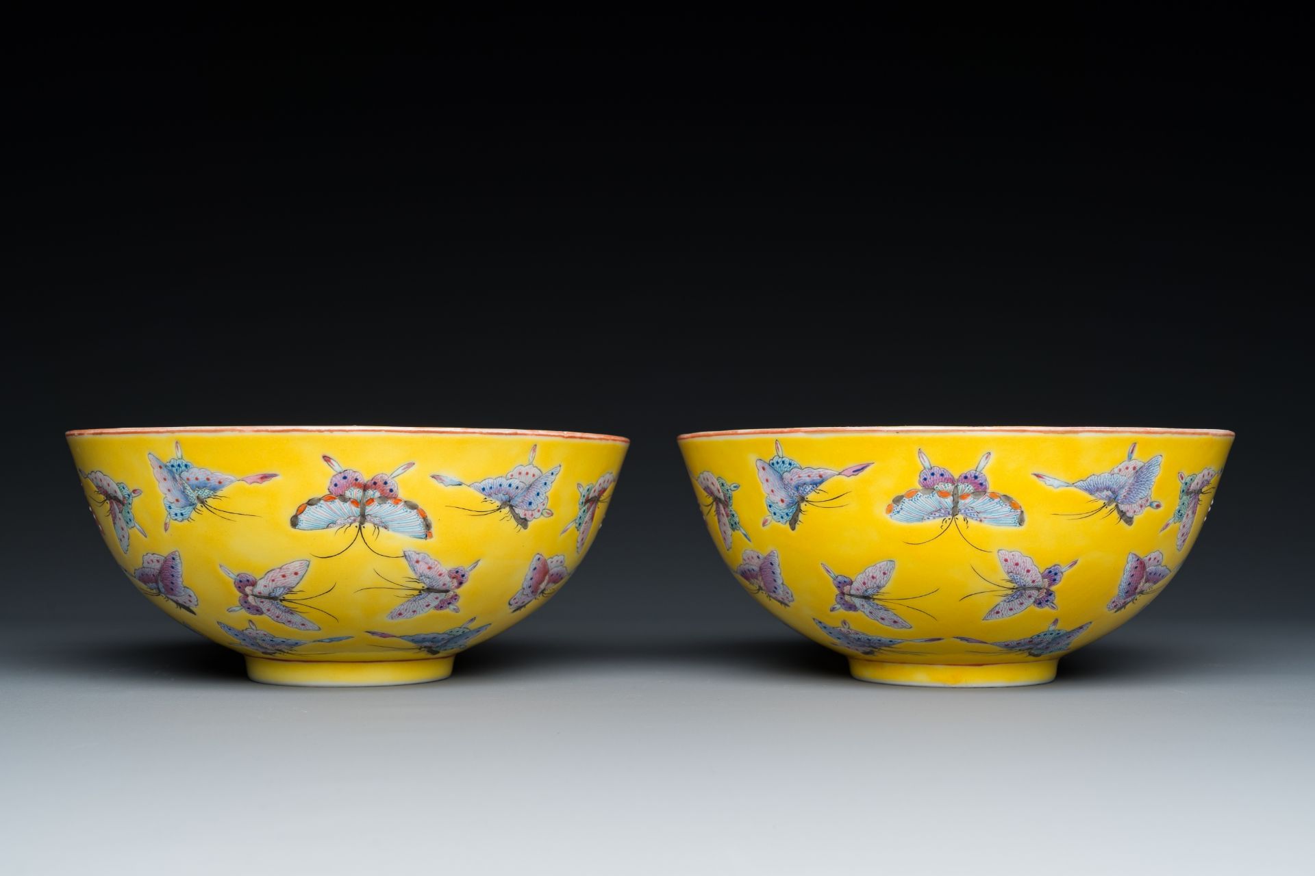 A pair of Chinese famille rose yellow-ground 'butterfly' bowls, Tongzhi mark and of the period - Image 4 of 7