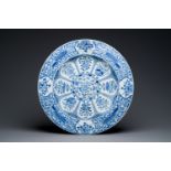 An exceptionally large Chinese blue and white 'peacock rim' dish, Kangxi
