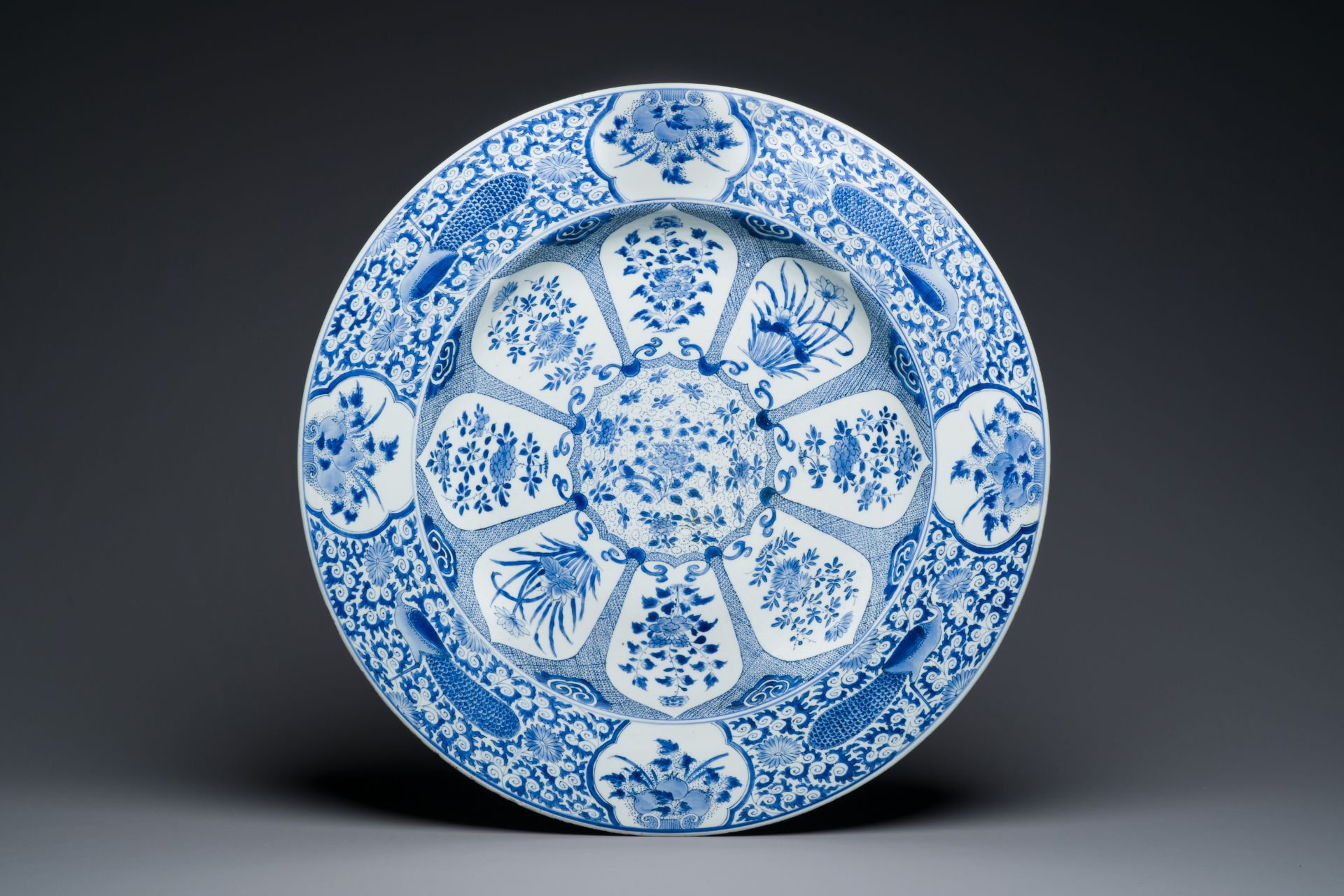 An exceptionally large Chinese blue and white 'peacock rim' dish, Kangxi