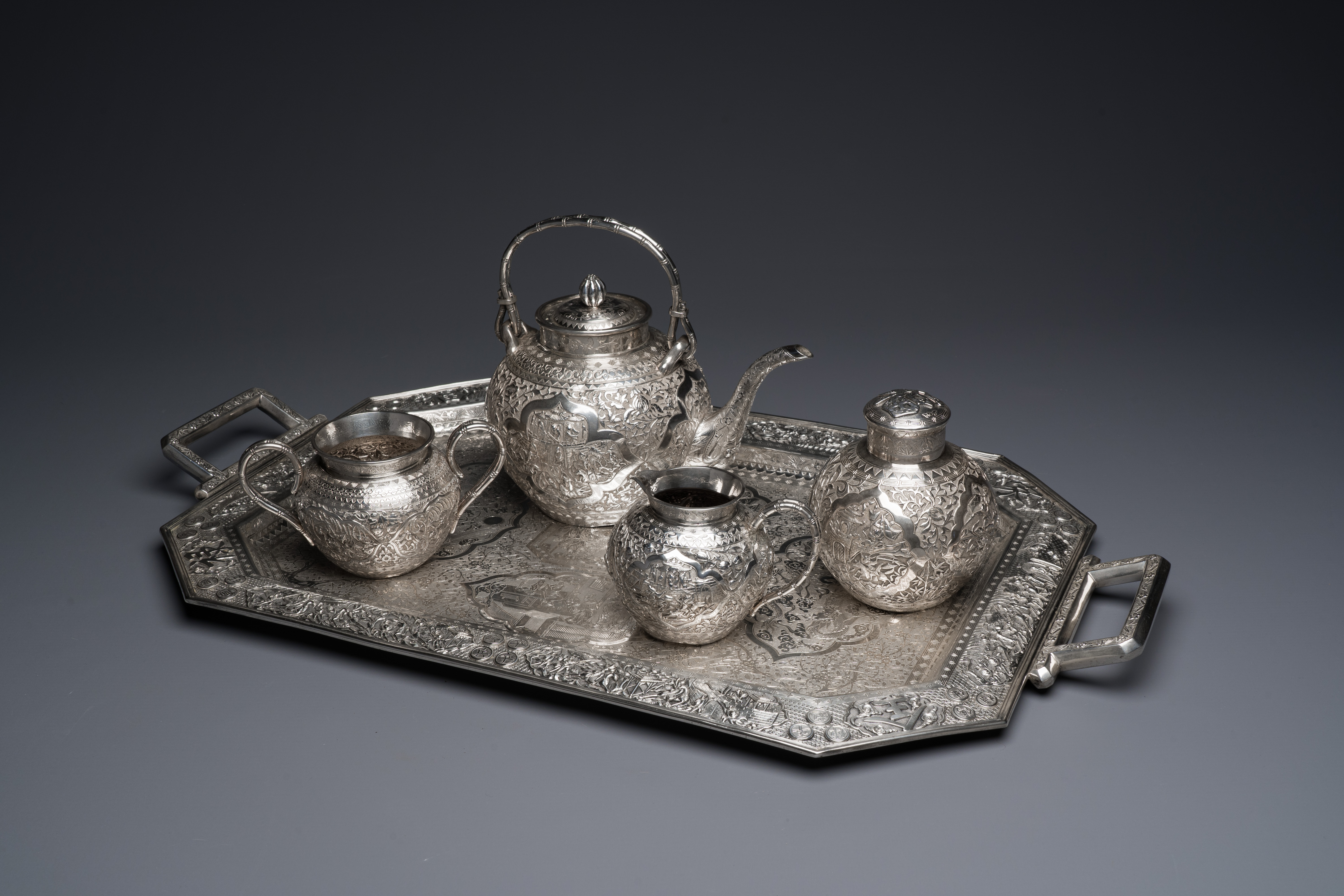 A Chinese silver 4-piece tea service on tray, Tu Mao Xing mark, 19th C.