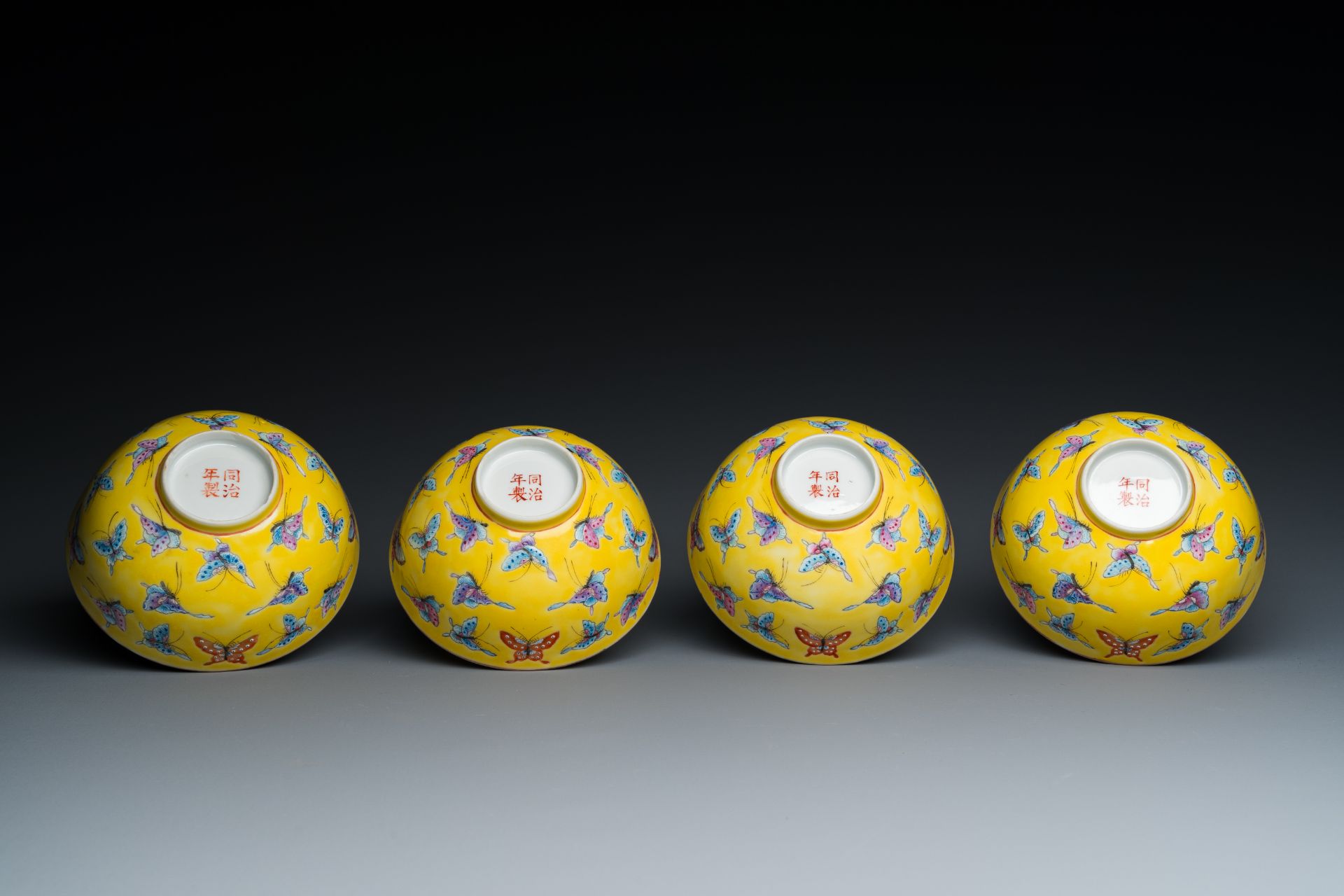 Four Chinese famille rose yellow-ground 'butterfly' bowls, Tongzhi mark and of the period - Image 7 of 7