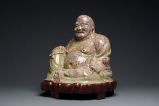 A massive Chinese flambe-glazed Shiwan pottery figure of Buddha, 18/19th C.
