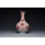 A Chinese copper-red bottle vase with floral scrolls, Qianlong