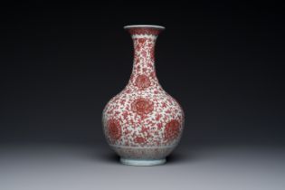 A Chinese copper-red bottle vase with floral scrolls, Qianlong