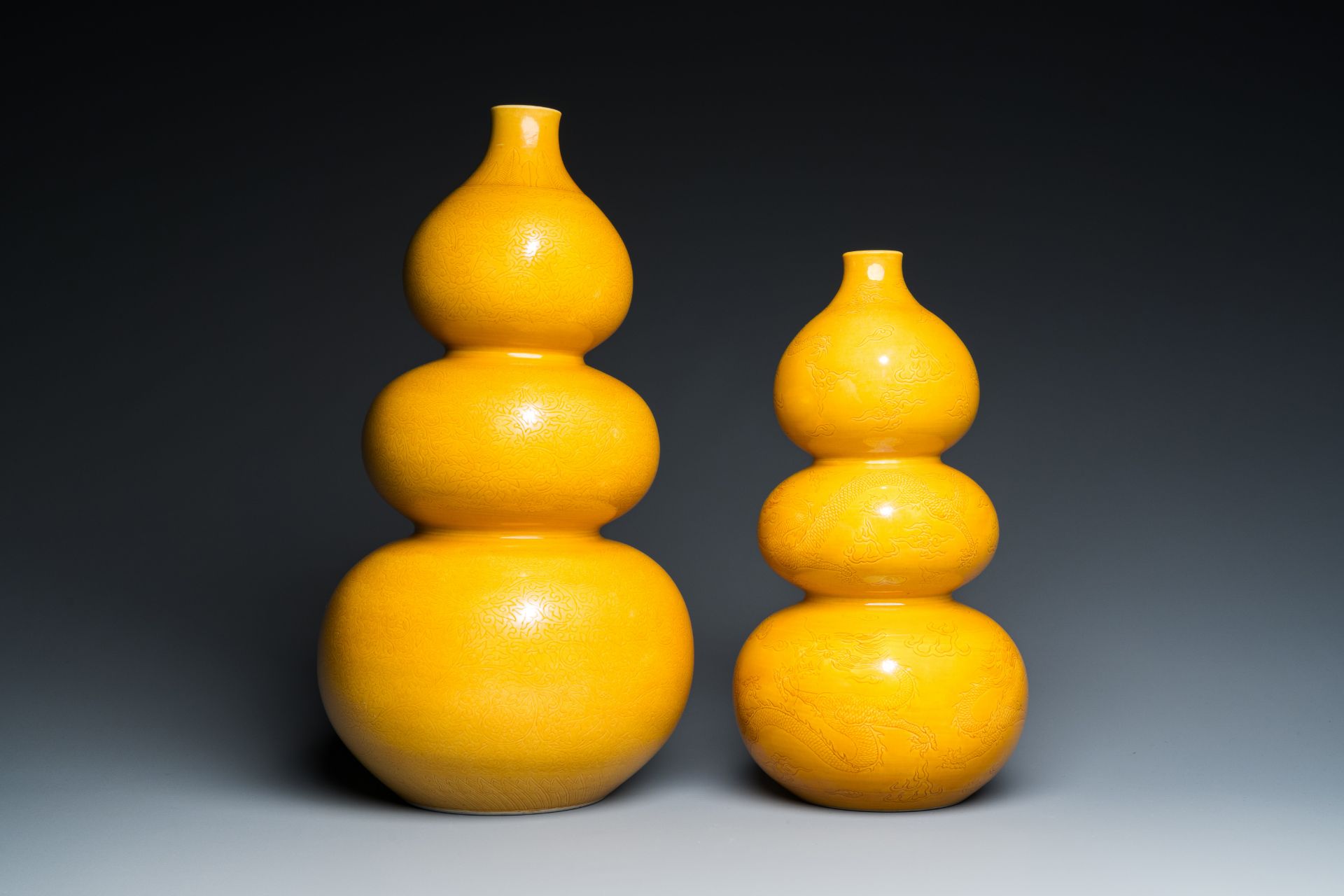 Two Chinese monochrome yellow-glazed triple gourd vases with incised designs of lotus scrolls and dr - Image 3 of 7