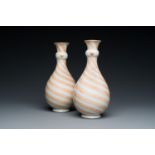 A rare pair of Chinese bottle vases with iron-red design in the style of Venetian glass, Kangxi