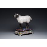 A Chinese cloisonne model of a sheep standing on a rectangular base with Arabic inscription, Qing
