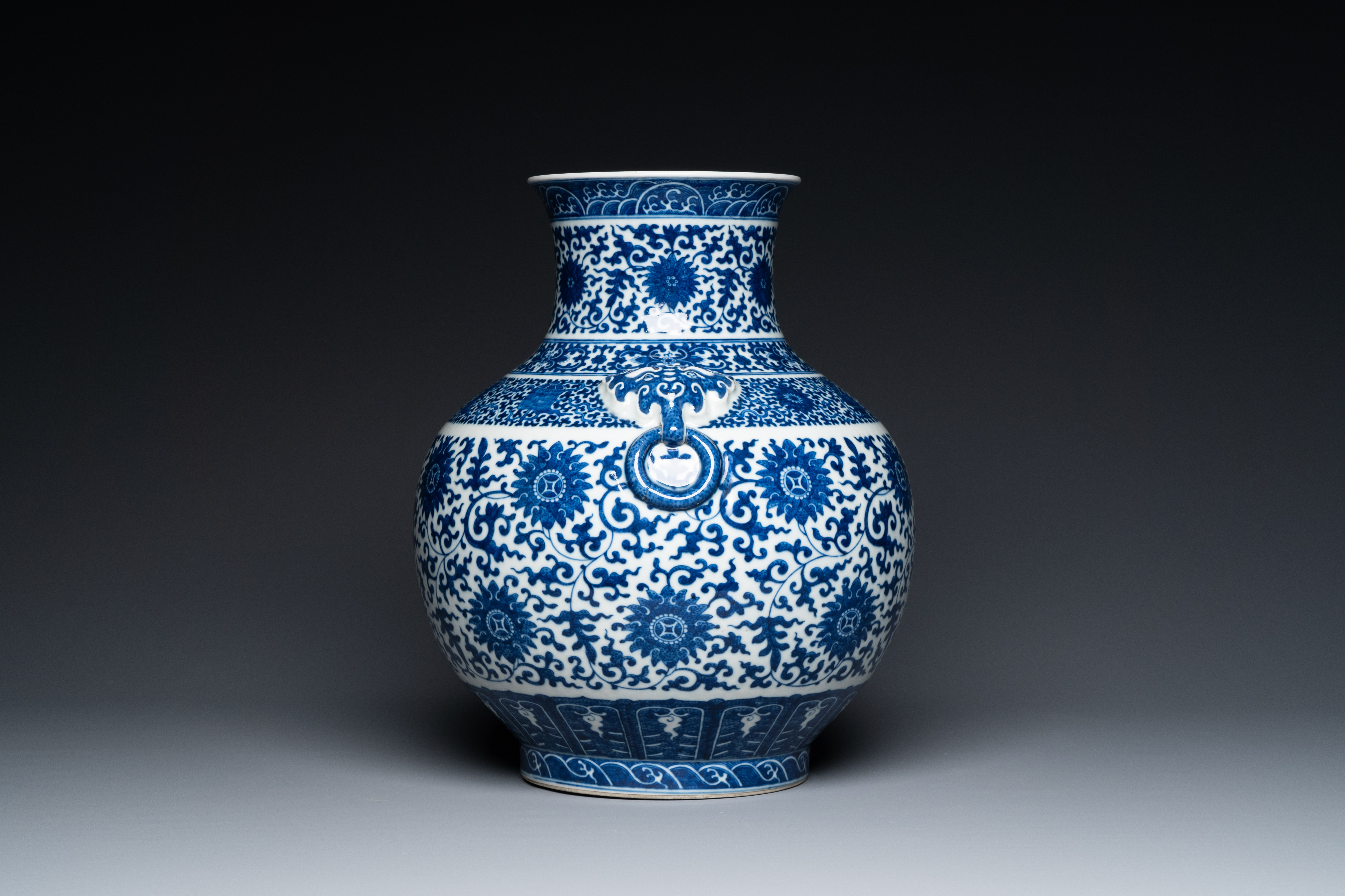 A Chinese blue and white 'hu' vase with lotus scrolls, Qianlong mark, 19th C. - Image 2 of 6