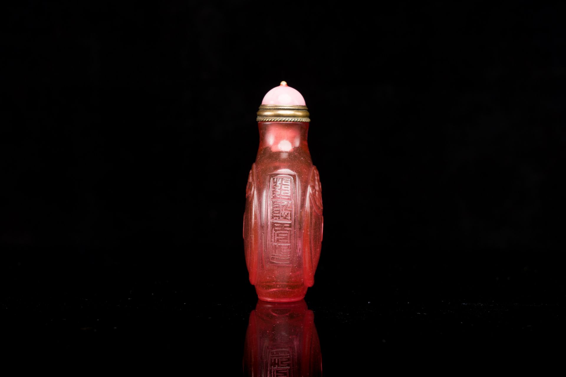 A Chinese ruby-pink glass 'bats' snuff bottle, Qianlong mark and of the period - Image 4 of 6