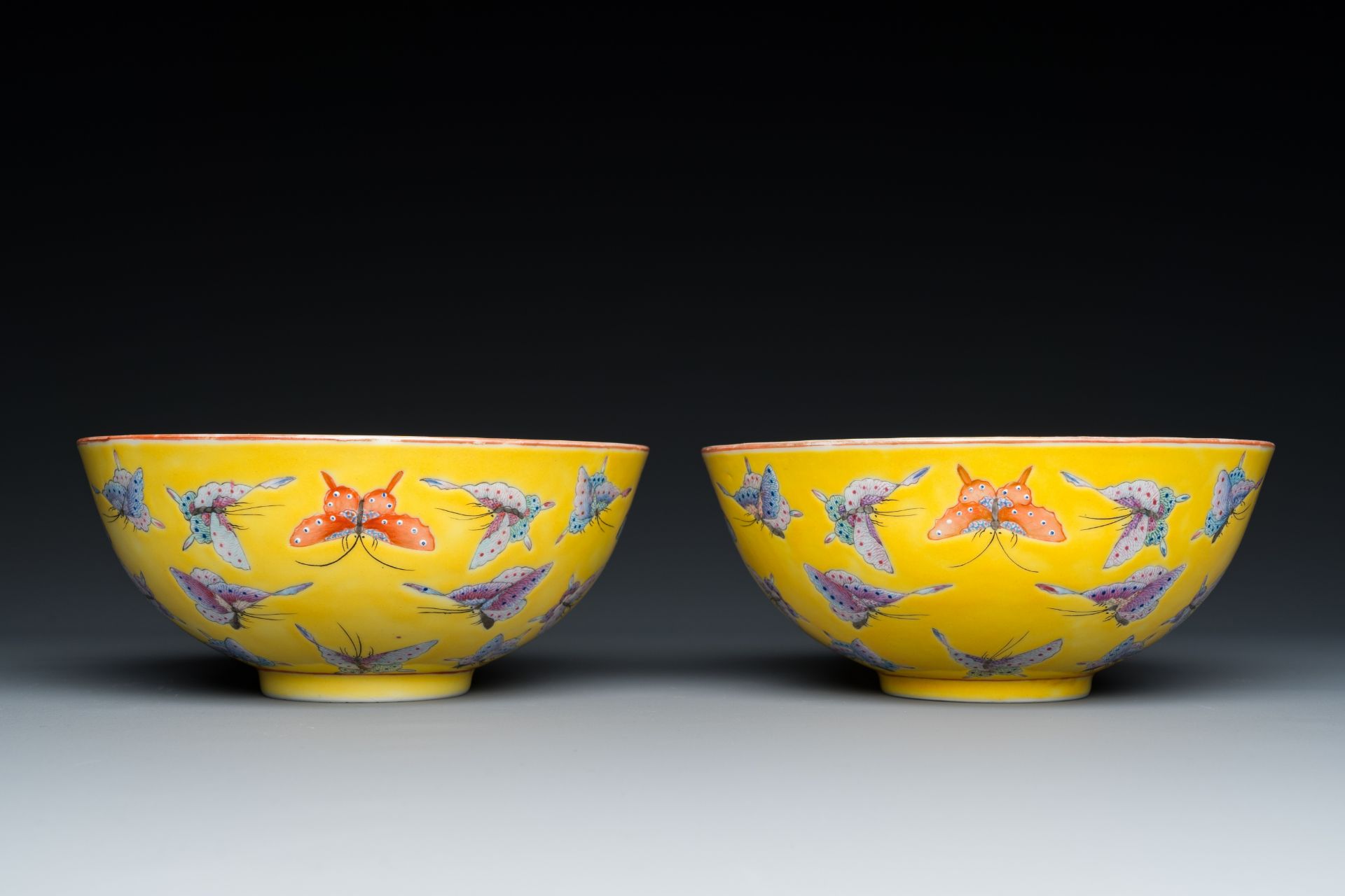 A pair of Chinese famille rose yellow-ground 'butterfly' bowls, Tongzhi mark and of the period - Image 3 of 7