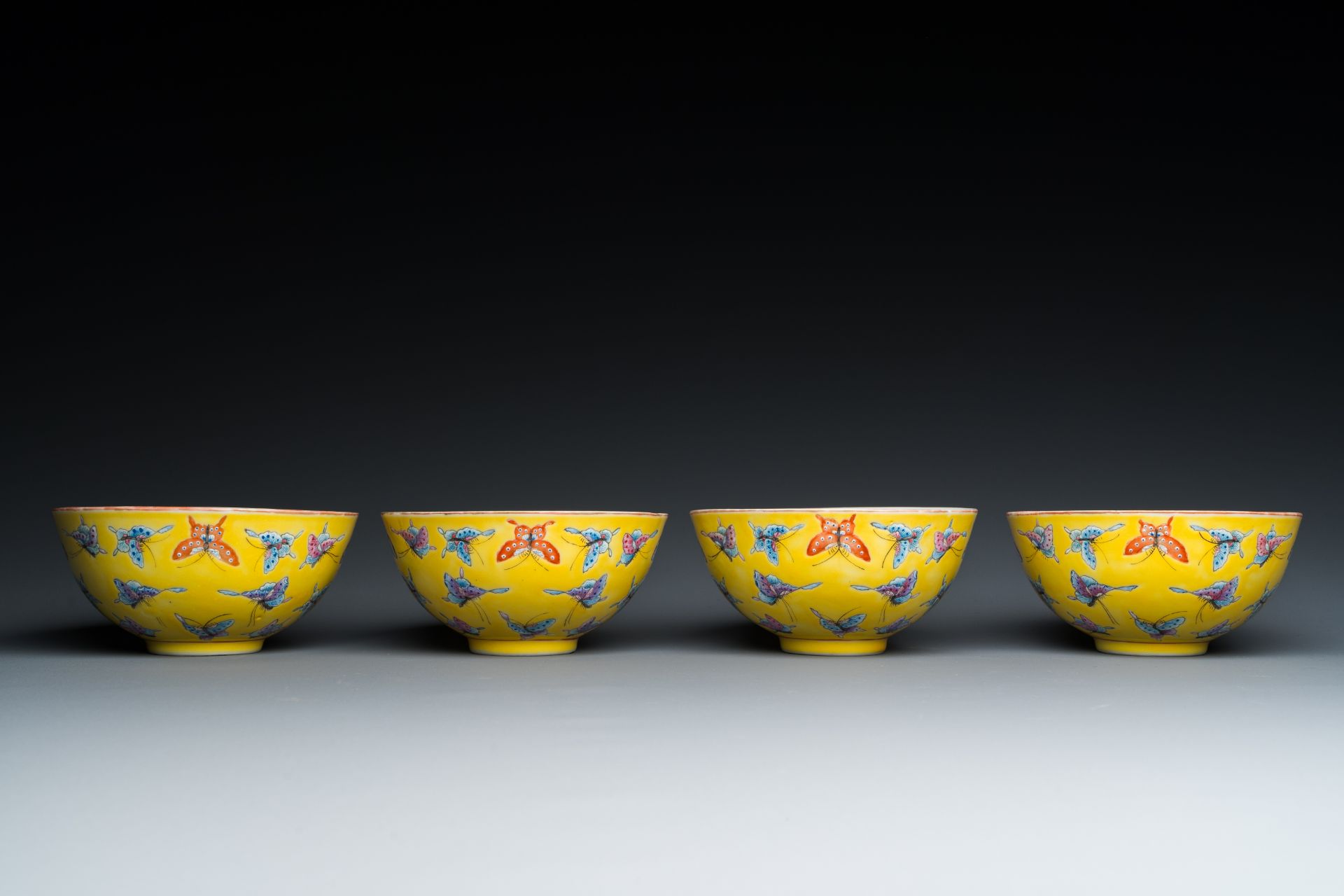 Four Chinese famille rose yellow-ground 'butterfly' bowls, Tongzhi mark and of the period - Image 4 of 7