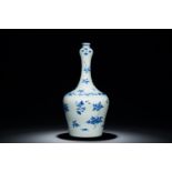 A Chinese blue and white bottle vase with floral designs, Transitional period