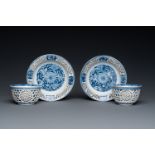 A pair of Chinese blue and white reticulated double-walled cups and saucers, Kangxi