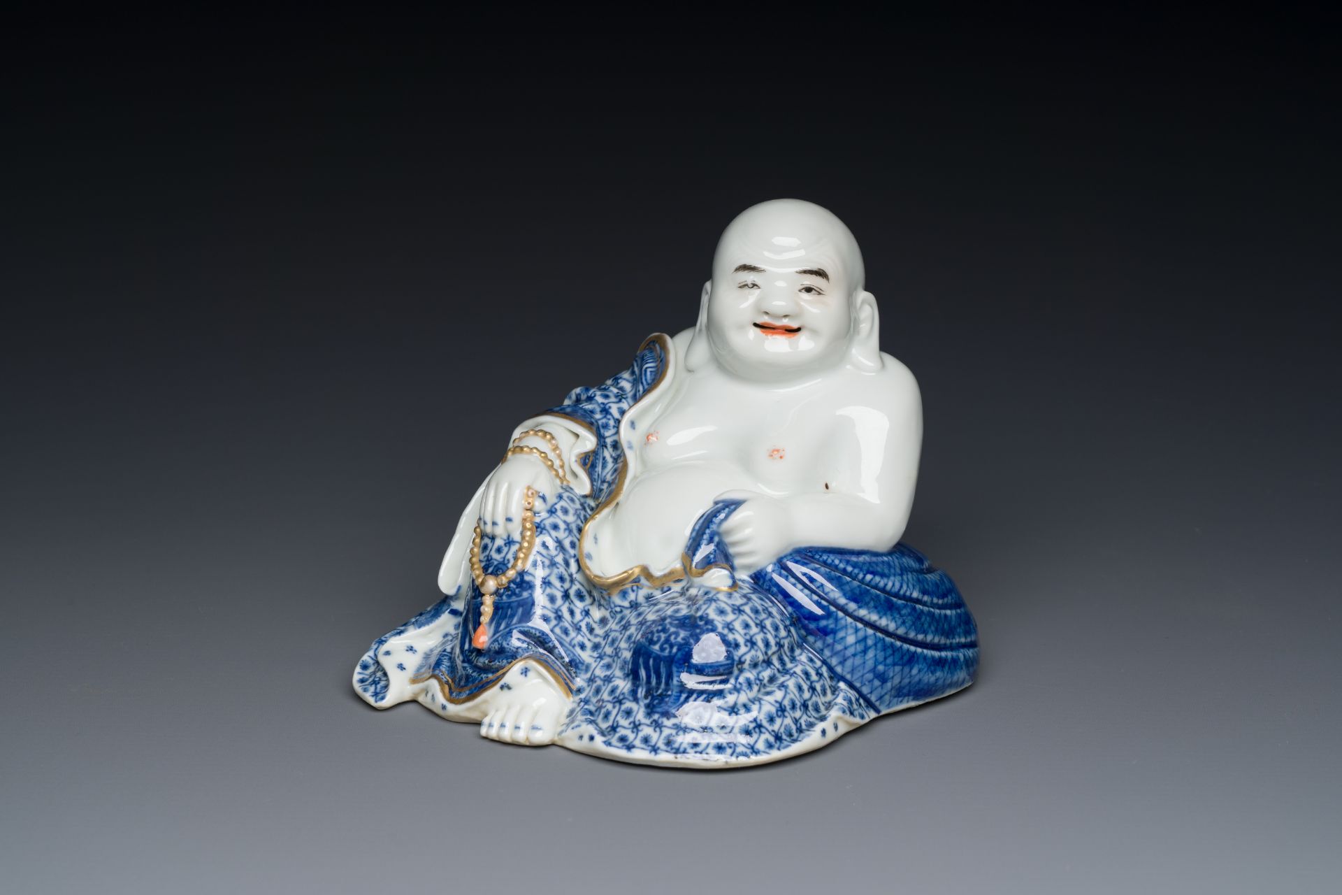 A Chinese blue and white seated Buddha, You Lin Ji Zao 游林記造 mark, Republic