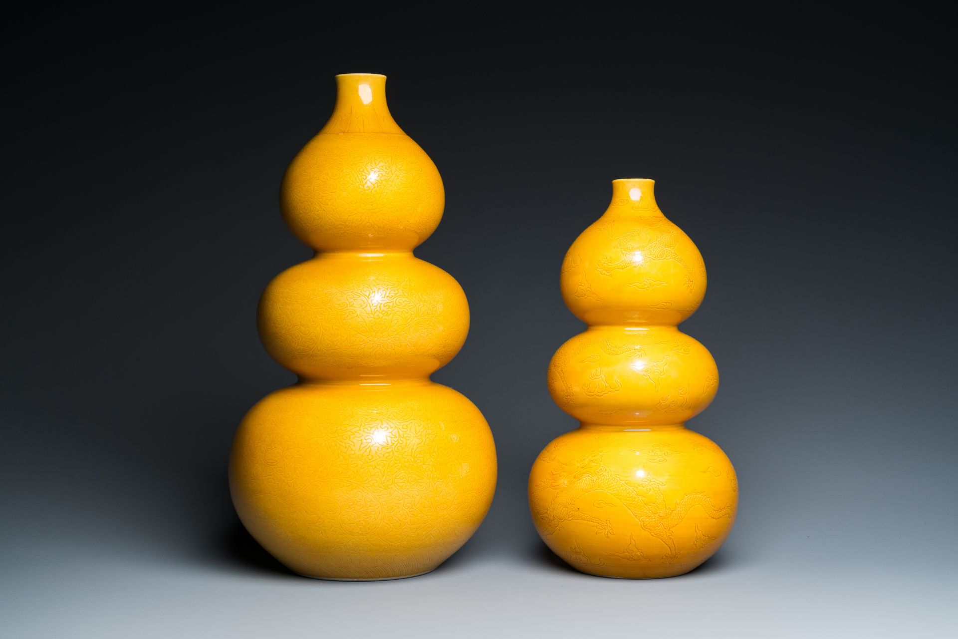 Two Chinese monochrome yellow-glazed triple gourd vases with incised designs of lotus scrolls and dr - Image 4 of 7