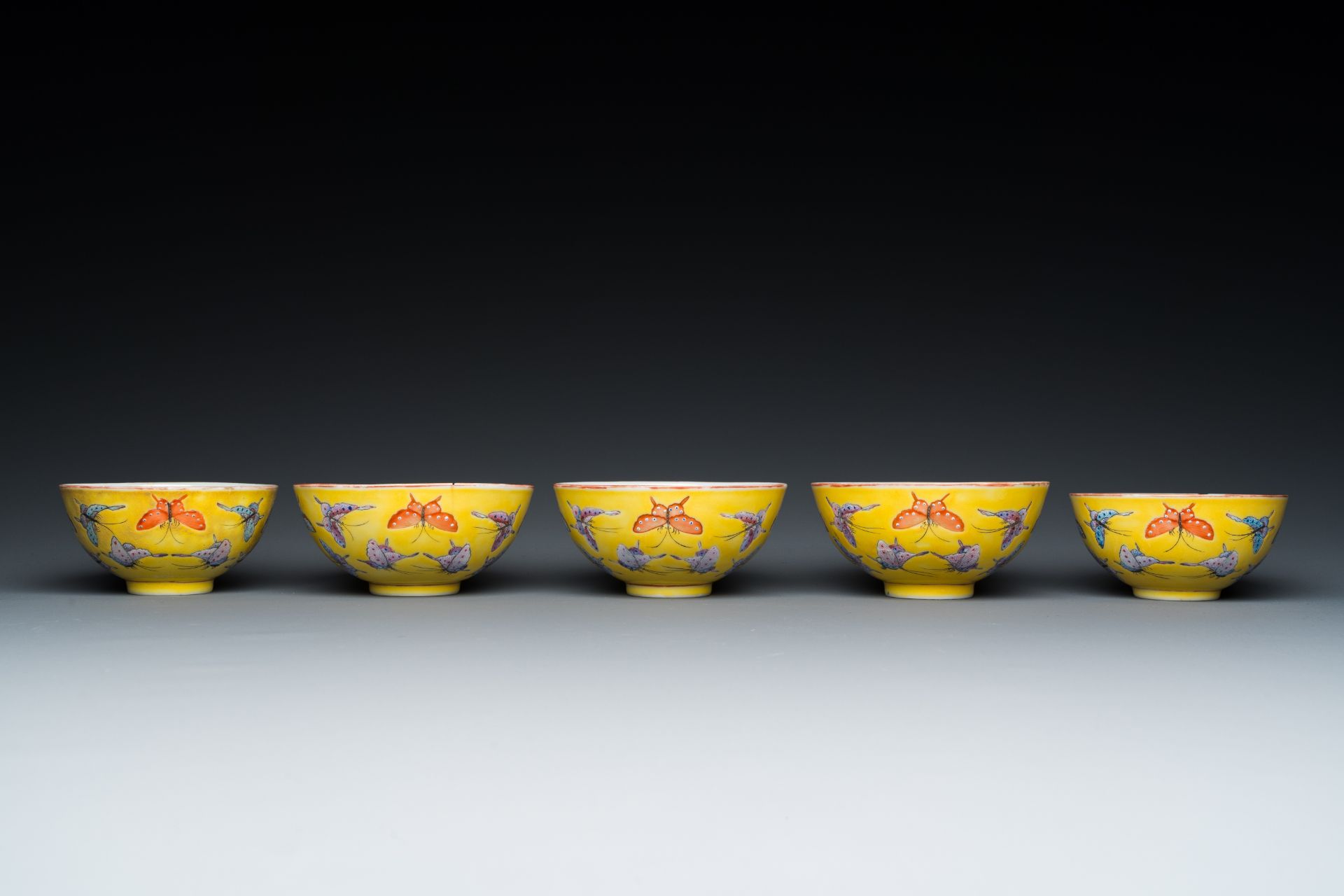 Five Chinese famille rose yellow-ground 'butterfly' bowls, Tongzhi mark and of the period - Image 3 of 7